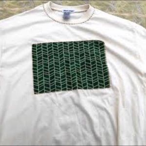 Unisex Shirt. We carry sizes Small - XL